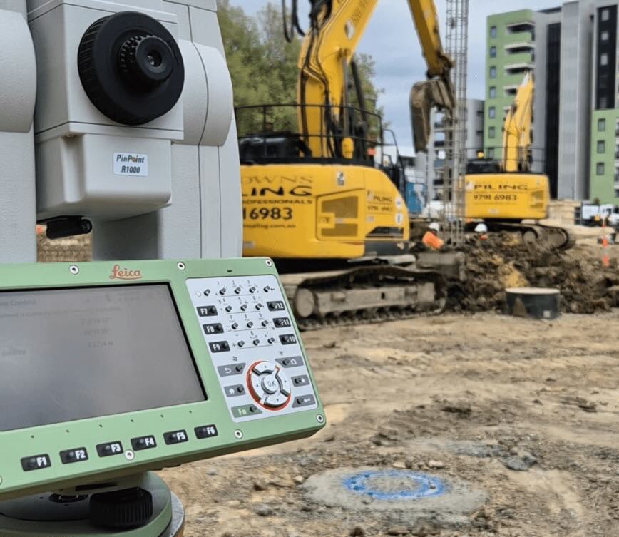 Engineering surveying equipment used for control surveys and earthworks monitoring on construction site in Melbourne