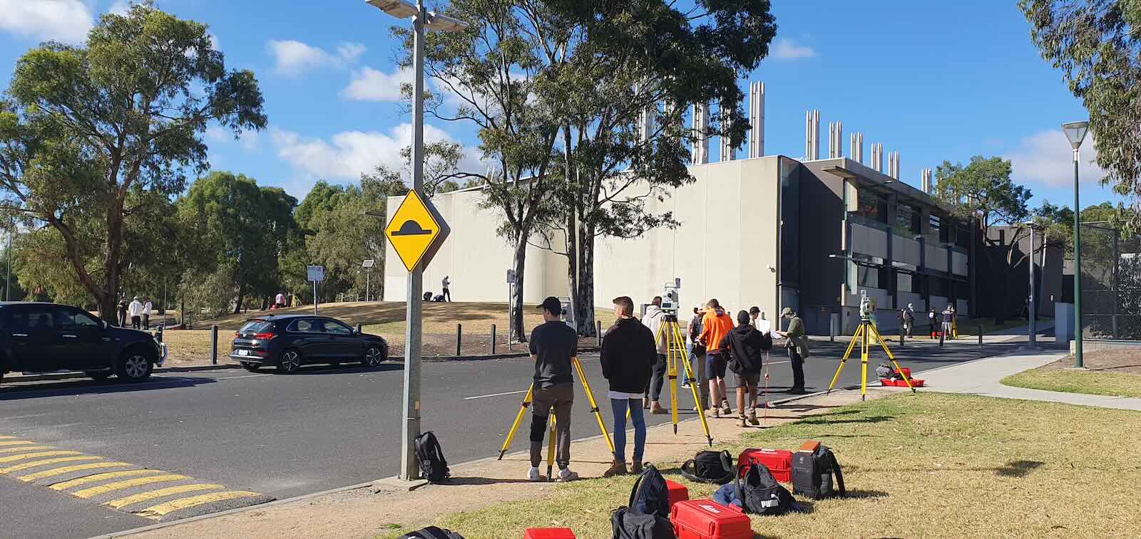 Construction surveying training in Melbourne with trainees learning total station surveying techniques on site