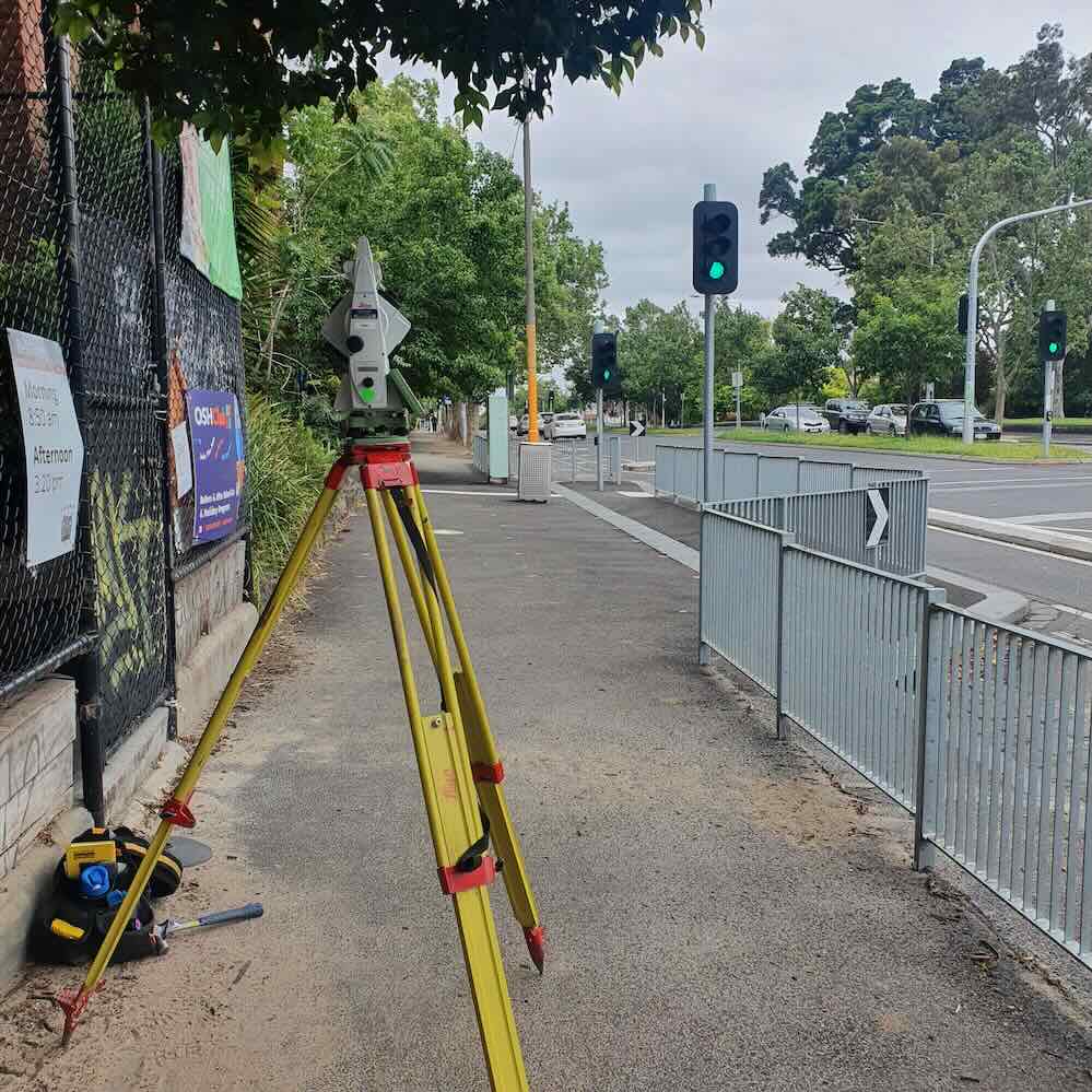 Surveying equipment conducting a feature and level survey at a Melbourne road intersection for planning and construction works